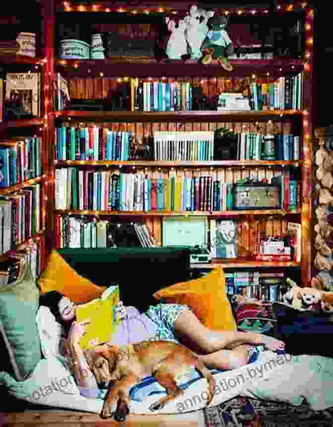 A Person Sitting In A Cozy Reading Nook, Holding A Copy Of The Birthday Candle Sujatha Lalgudi