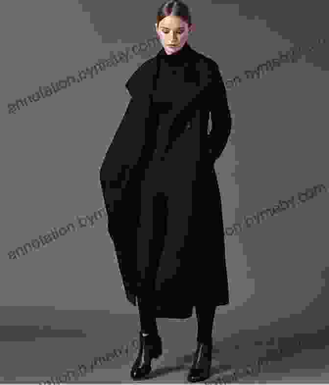 A Woman Wearing A Long Black Coat In A Modern Fashion Context The Long Black Coat Diane Greenberg