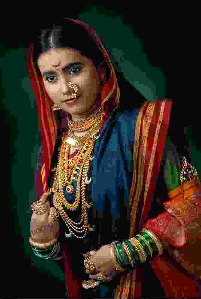 Main Character Of The Book, An Indian Woman With Intricate Jewellery And Traditional Attire, Holding A Candle The Birthday Candle Sujatha Lalgudi