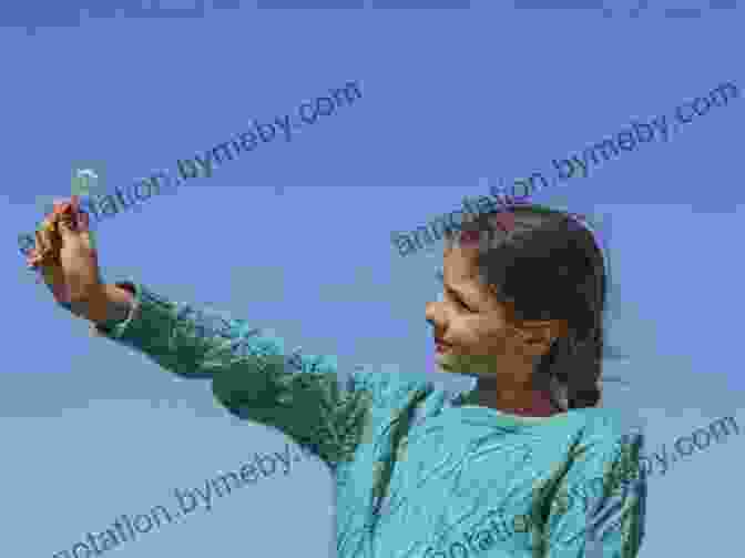 The World At Her Fingertips Book Cover: A Young Girl With Her Fingers Outstretched, Touching A Vibrant Globe. Helen Keller: The World At Her Fingertips (I Can Read Level 2)